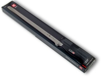 4 star ham carving knife in its plastic-covered cardboard box